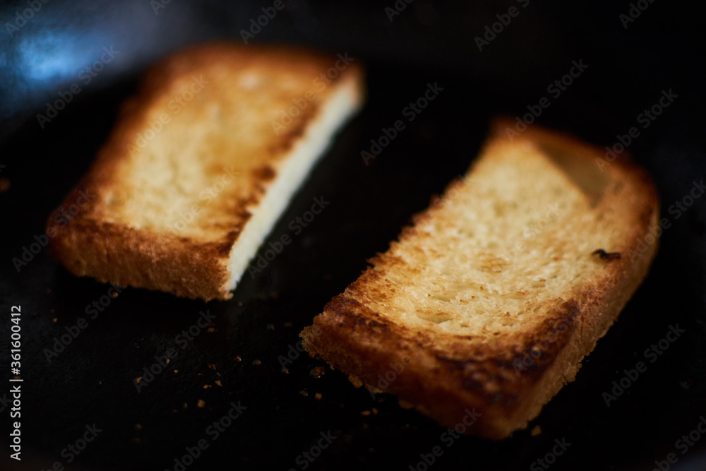 Slices of bread in a pan. Toast the toast. Slices of bread in a pan. Toast the toast.