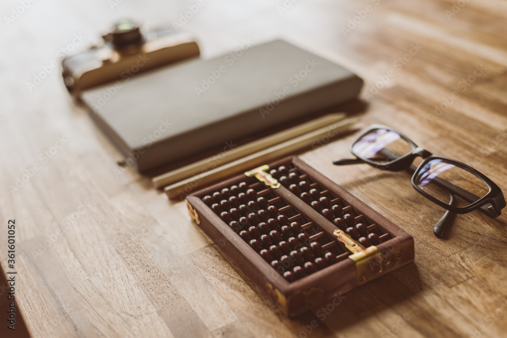 abacus and books on a table at home abacus and books on a table at home