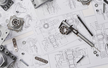 Engineer technician designing drawings mechanical parts engineering Engine.manufacturing factory Industry Industrial work project blueprints measuring bearings caliper tools