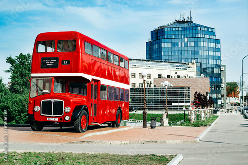 Photography Landscape of a modern architectural building with a red bus