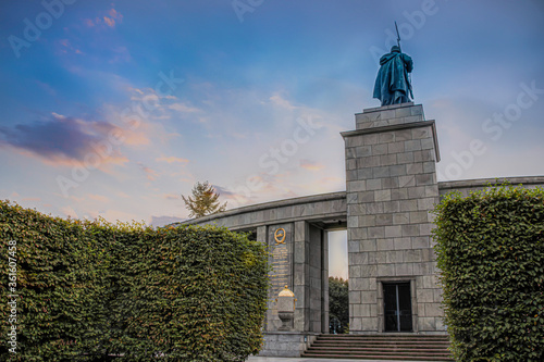 Photo Berlin Tiergarten Soviet War Memorial statue of soldier on stone tower and archw
