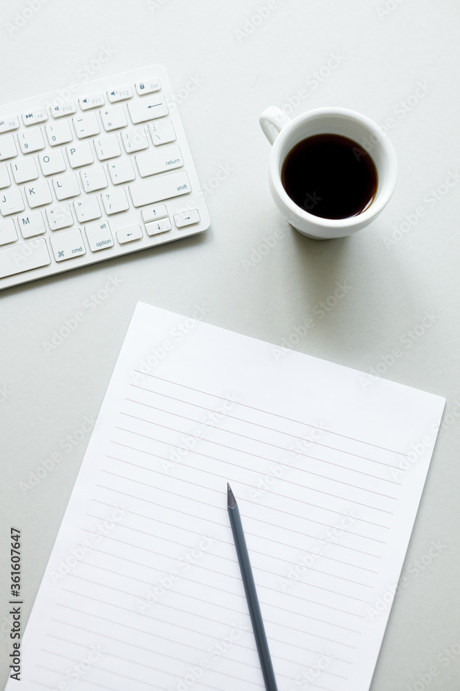 Blank paper for notes, cup of coffee and keyboard. Blank paper for notes, cup of coffee and keyboard.