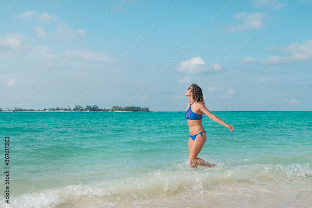 Young Woman Playing in Tropical Water Young Woman Playing in Tropical Water