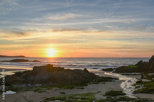 Summer sunset with few clouds at Frouxeira beach, Valdoviño, Galicia, Spain