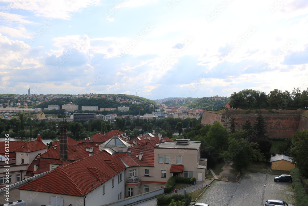 Panorama of Prague and the Vltava river on a hot, cloudy summer day