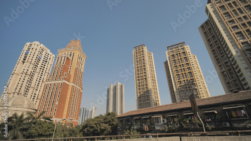 Skyscrapers of Mumbai in motion from a car.
