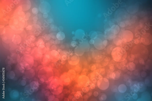 A festive abstract red orange pink blue gradient background texture with glitter defocused sparkle bokeh circles. Card concept for Happy New Year, party invitation, valentine or other holidays.