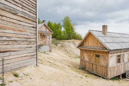 Wooden houses in small village near Volga river in cloudy day
