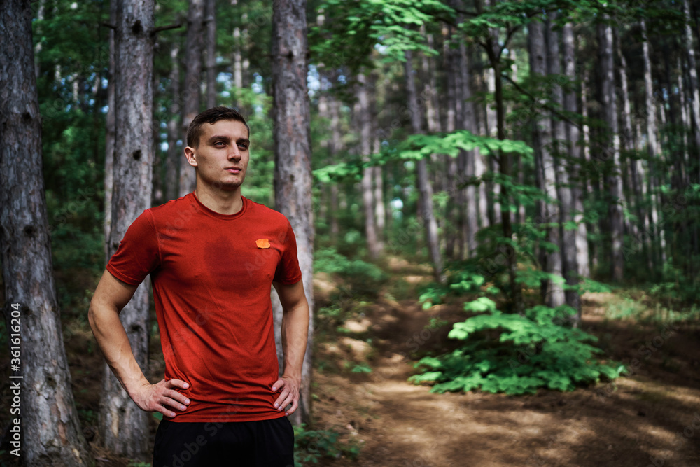 Young man running alone on an empty road Young man running alone on an empty road