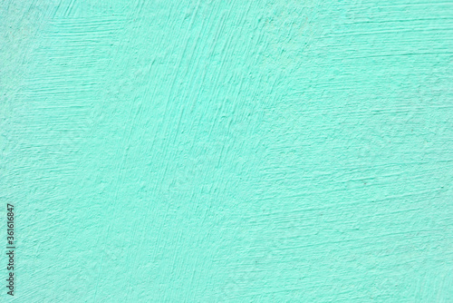 Texture of green stucco for modern interior. Abstract green background.