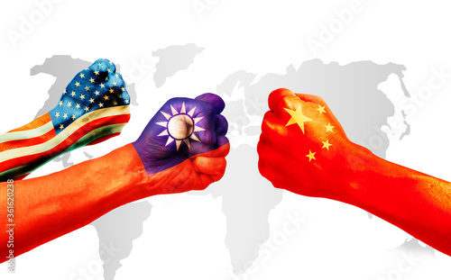 Flags of usa or United States of America, Taiwan and China on hands punch to each others on light gray world map background, USA and Taiwan vs China in World political war concept photo