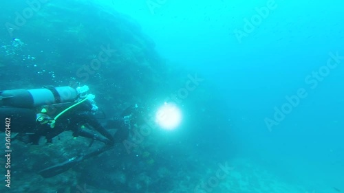 Wallpaper Mural Scuba diver swim in the Mediterranean Sea with underwater light. Torontodigital.ca