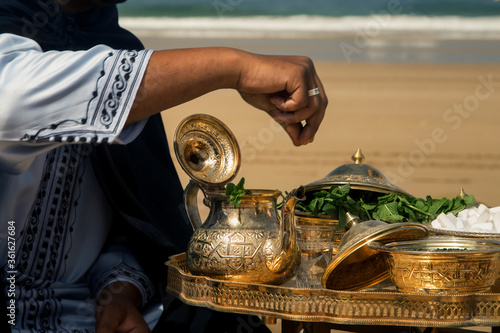 wedding ceremony on the ocean in Morocco, traditional Moroccan tea with mint