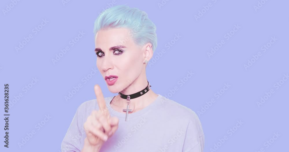 Fashion Sexy swag Girl with blue hair, stylish casual look posing in studio against blue background. Urban stylish and accessories concept Fashion Sexy swag Girl with blue hair, stylish casual look posing in studio against blue background. Urban stylish and accessories concept