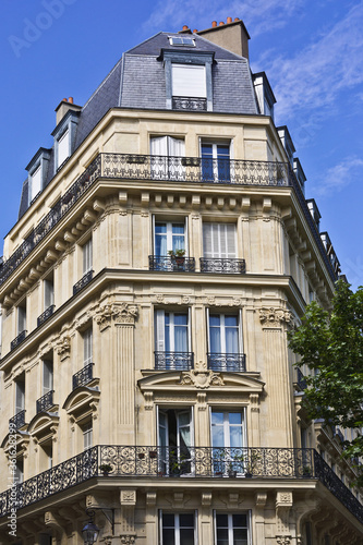 View of Unique traditional French windows and balconies. Paris, France. © dbrnjhrj