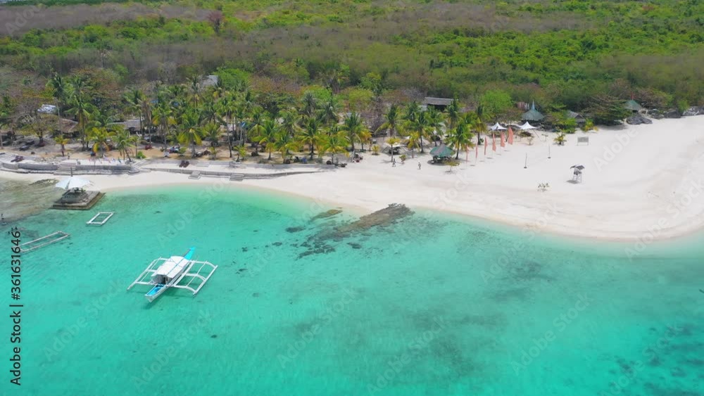 Aerial Over Turquoise Waters Off Boracay Island With Boats Moored Near Beach. Follow Shot Aerial Over Turquoise Waters Off Boracay Island With Boats Moored Near Beach. Follow Shot