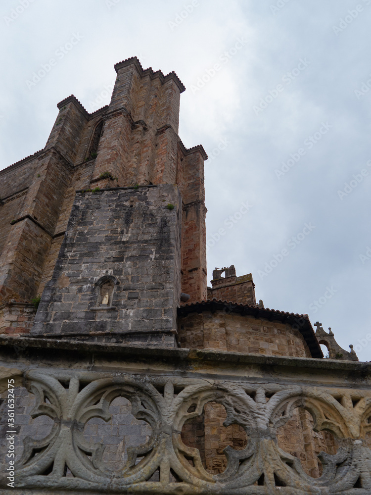 Cathedral walls and towers on a cloudy day