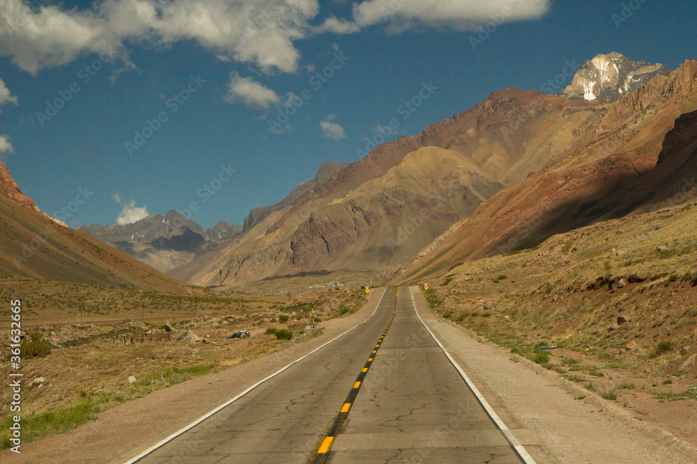 Desert road. Traveling along the asphalt route 40 across the arid and rocky mountains. Desert road. Traveling along the asphalt route 40 across the arid and rocky mountains.