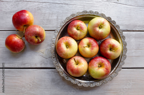Fresh apples on the wooden background