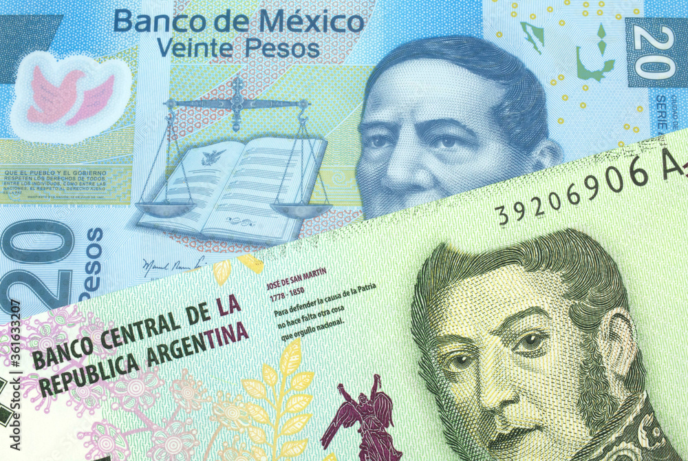 Fototapeta premium A five peso bill from Argentina, close up in macro with a blue twenty peso bank note from Mexico