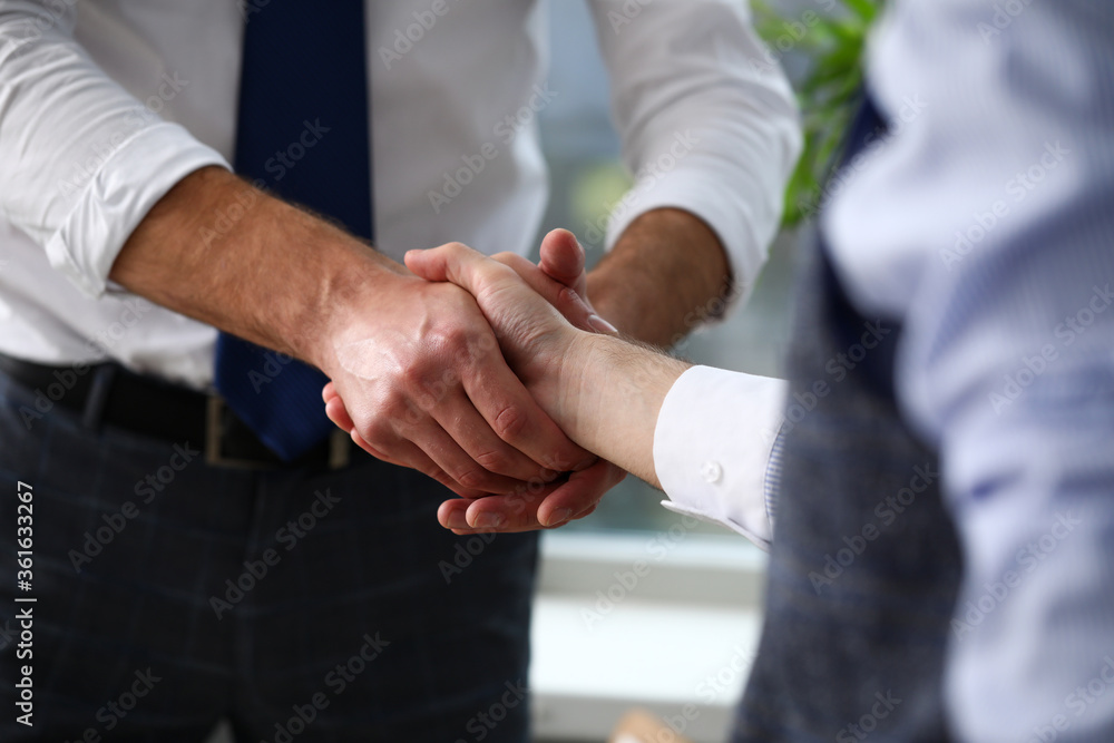 Man in suit and tie give hand as hello in office closeup. Friend welcome mediation offer positive introduction thanks gesture summit executive approval motivation male arm strike bargain Man in suit and tie give hand as hello in office closeup. Friend welcome mediation offer positive introduction thanks gesture summit executive approval motivation male arm strike bargain