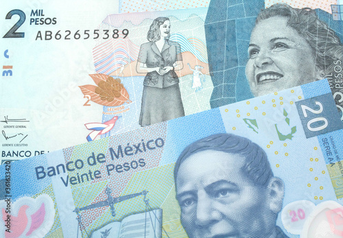 Wallpaper Mural A blue twenty Mexican peso bank note with a blue two thousand peso note from Colombia close up in macro Torontodigital.ca