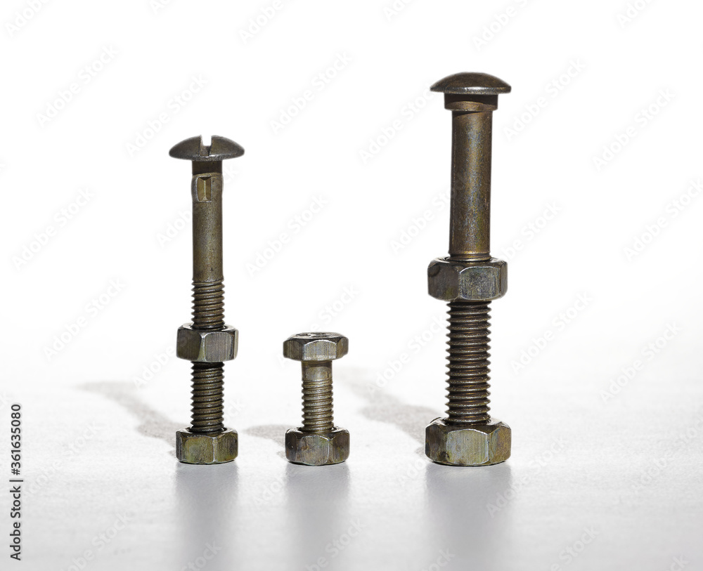 Row of screw with shadow on white background, isolated, closeup Row of screw with shadow on white background, isolated, closeup
