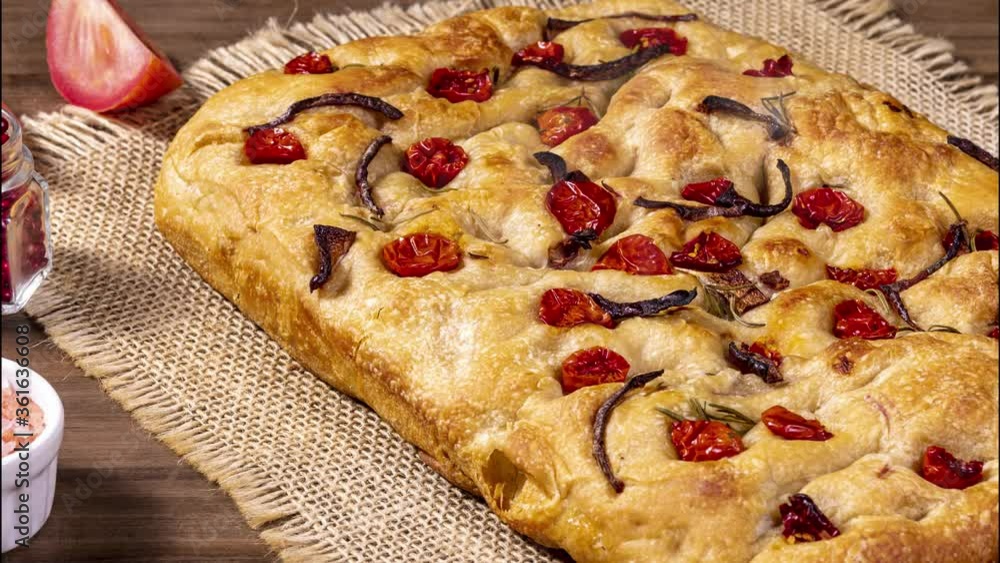 Traditional Italian Focaccia with pepperoni, cherry tomatoes, black