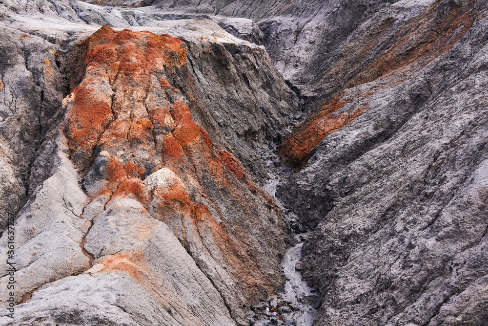 gully in a clay slope devoid of soil