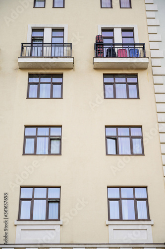 Direct view of the facade of a modern apartment building with balconies.