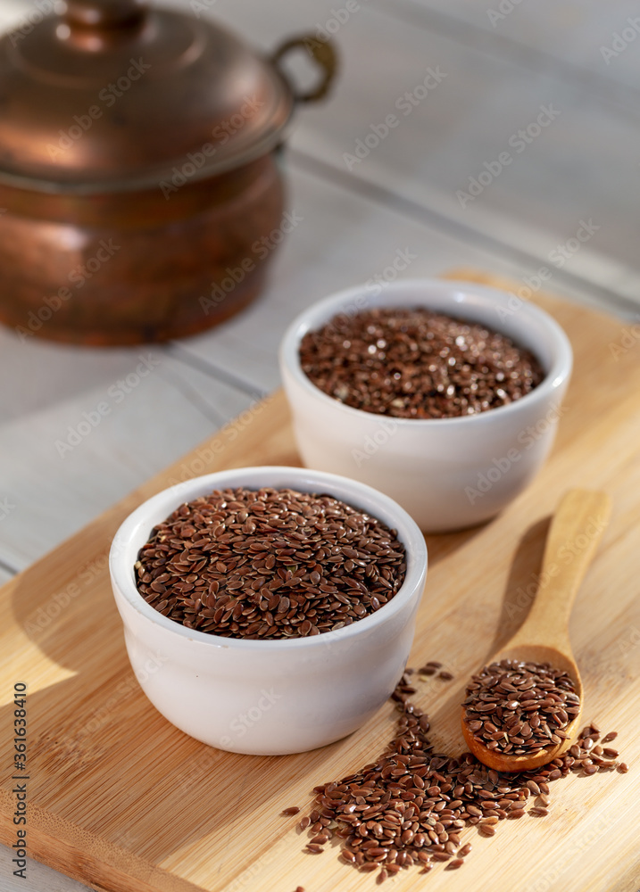 Siyez (siyazan) wheat bulgur in bowl and spoon on wooden background Siyez (siyazan) wheat bulgur in bowl and spoon on wooden background