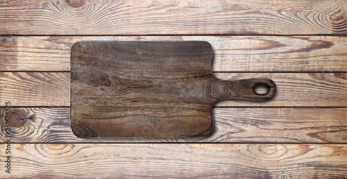 Empty vintage cutting board on planks.