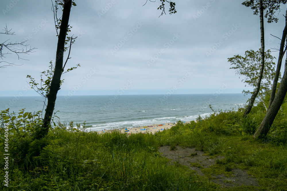 view from the escarpment to the beach on the Baltic Sea on a summer day