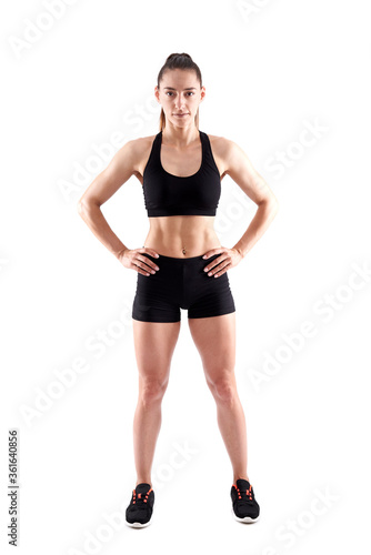 Young female fitness model on white