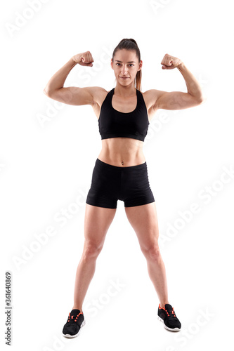 Young female fitness model on white