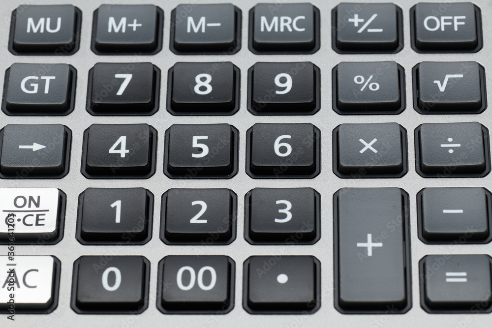 business office desk closeup - digital keyboard of the accounting calculator close up business office desk closeup - digital keyboard of the accounting calculator close up