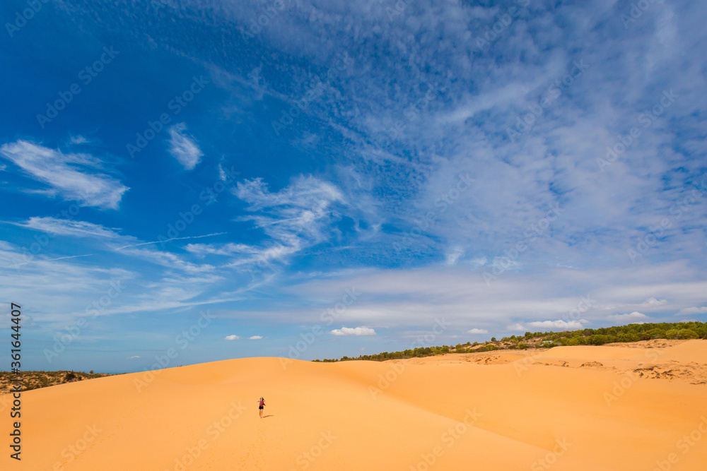 Happy woman on Red sand dunes in Vietnam Happy woman on Red sand dunes in Vietnam