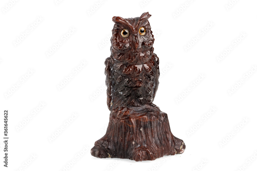 macro stone mineral owl from obsidian on a white background macro stone mineral owl from obsidian on a white background