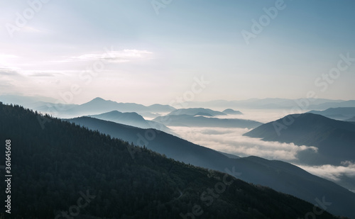 Fototapeta Naklejka Na Ścianę i Meble -  Stunning morning landscape view of the fog river flowing by the valley between the mountains. Mala Fatra mountains, Slovak Republic.