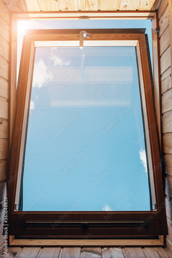 In the early morning, a dormer-window open for airing - fresh air into the house In the early morning, a dormer-window open for airing - fresh air into the house