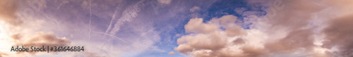 Summer sunset dranatic sky panorama with fleese clouds. Summer evening sky and weather concept high resolution background.