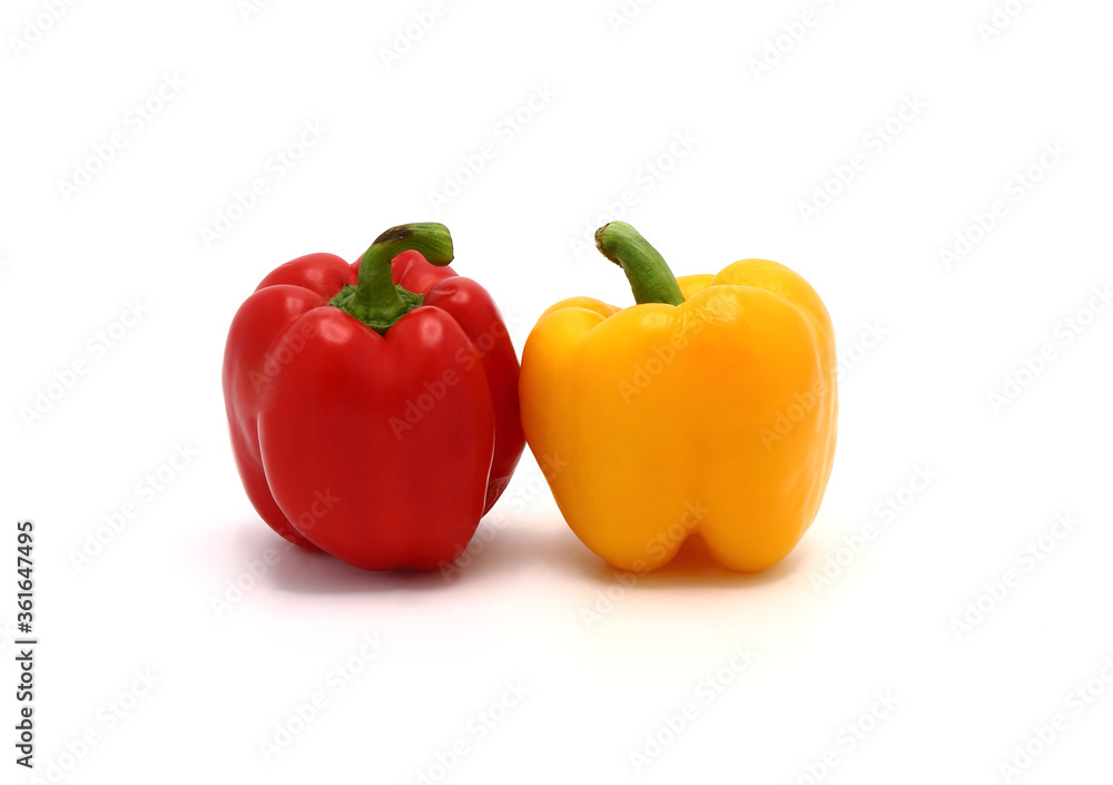 Two sweet peppers of yellow and red color on a light background. Natural product. Natural color. Close-up.