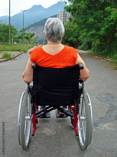 Disabled old woman on a wheelchair, Brazil