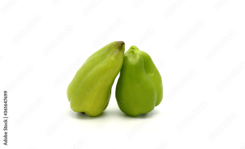 Two sweet peppers of green color on a light background. Natural product. Natural color. Close-up. Two sweet peppers of green color on a light background. Natural product. Natural color. Close-up.