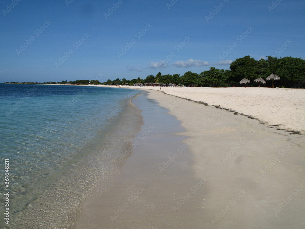Playa Ancón -  a white beach close to Trinidad, blue waters of Caribbean Sea and blue sky, Cuba
