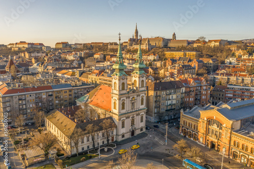 Aerial drone shot of facade of St. Anne Parish church during Budapest sunrise