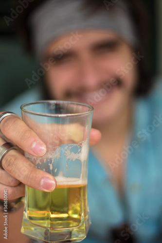 Man toasting with a glass of beer