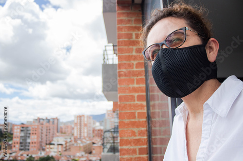 Masked woman out of the window