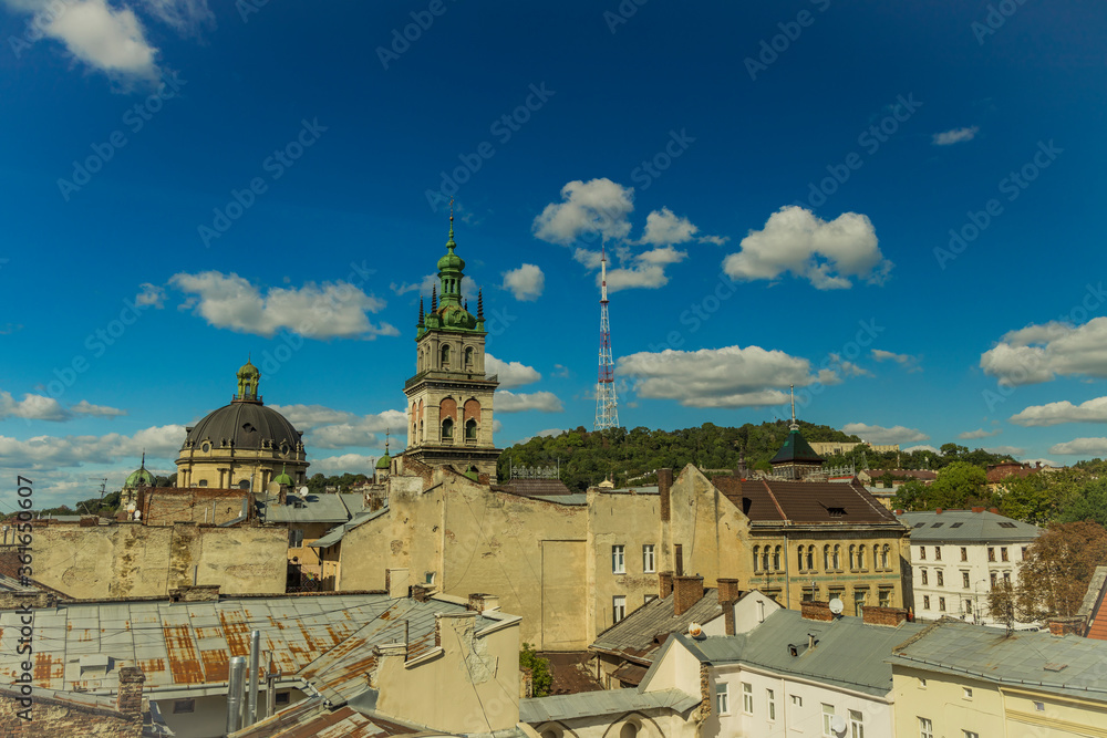 Lviv old city roof top landmark view Eastern European heritage touristic site in Ukraine summer clear weather day time medieval urban