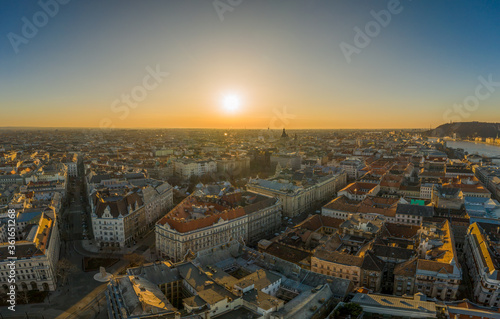 Aerial drone shot of east facade of St. Stephen's Basilica in Budapest sunrise morning glow